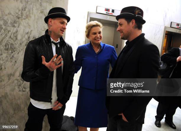 Benji, left, and Joel Madden of the band Good Charlotte, met with Rep. Carolyn Maloney, D-N.Y., while lobbying the Hill as envoys for the ENOUGH...