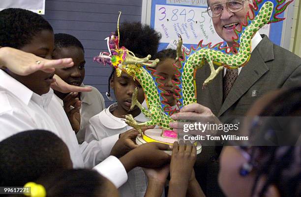 Rep. Bill Goodling, R-PA, displays a Japanese model dragon to students at Moten Elementary School in SE, Washington after the Congressman taught a...