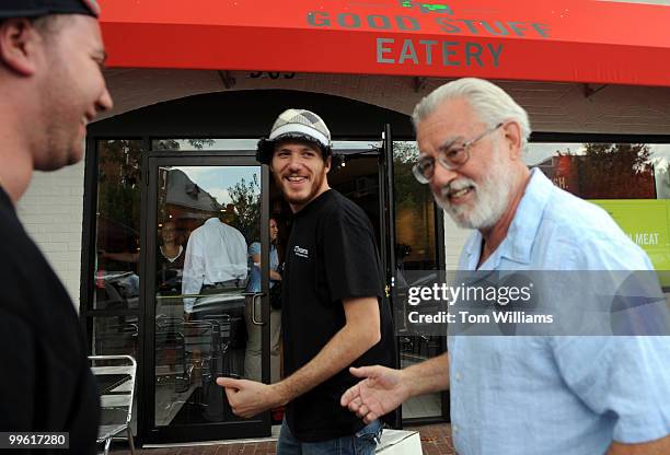 Spike Mendelsohn, center, owner of Good Stuff Eatery talks with his father Harvey and Mike Colletti, general manager, before the media preview for...