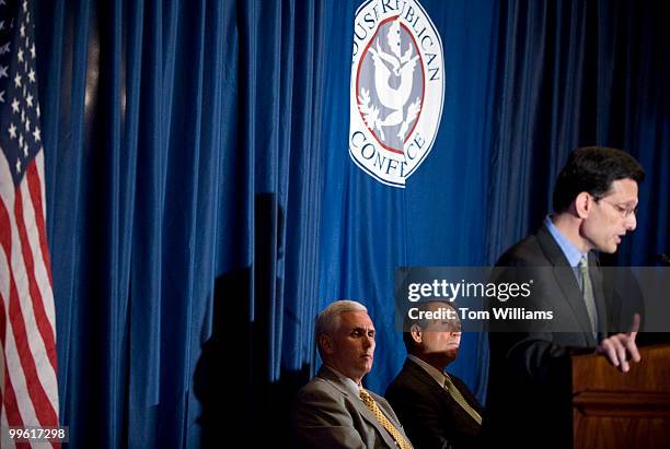 Conference Chair Mike Pence, R-Ind., left, and House Minority Leader John Boehner, R-Ohio, listen to House Minority Whip Eric Cantor, R-Va., address...