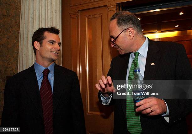 Driver Jeff Gordon talks to Sen. Chuck Schumer, D-N.Y., outside the Senate chamber, Thursday. Gordon was on the Hill visiting Senators to urge them...