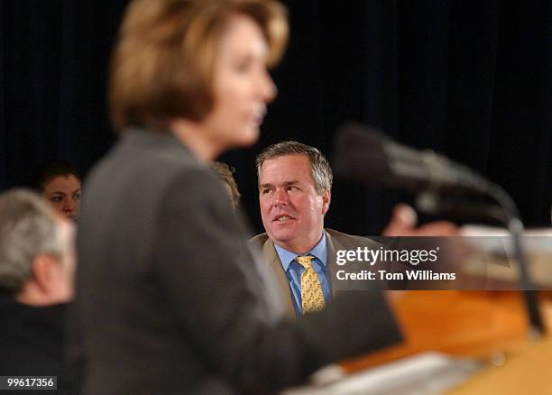 Gov. Jeb Bush, R-Fla., listens to a speech by House Minority Leader Nancy Pelosi, R-Calif., National Governors Association Winter Meeting. Pelosi and...
