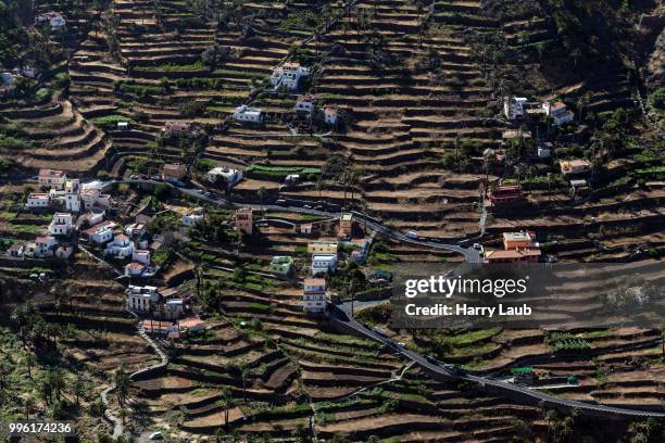view from mirador cesar manrique onto terraced fields and houses of hornillo, valle gran rey, la gomera, canary islands, spain - mirador stock pictures, royalty-free photos & images