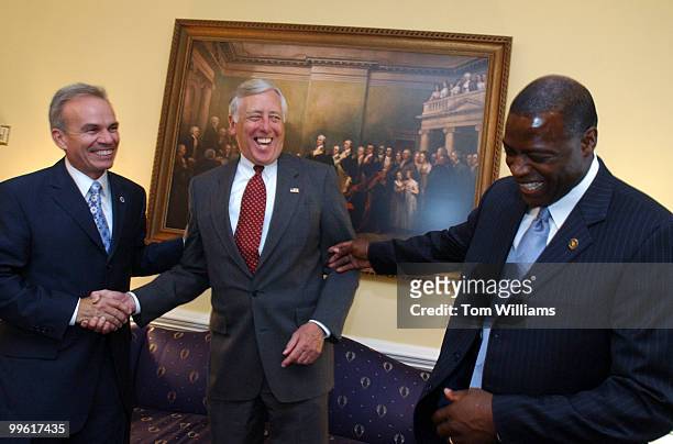 Former Redskin Darrell Green shares a laugh with Rep. Steny Hoyer, D-Md., center, and Terrence Jones, CEO of Wolf Trap, after meeting with Hoyer on...