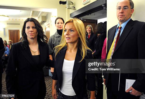 Spice Girl and United Nations Fund for Population Activities ambassador Geri Halliwell arrives at a news conference trailed by CARE Ambassador...