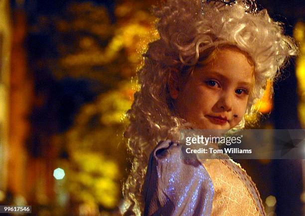 Haley Hodgson dressed as Marie Antoinette, poses for a picture on 9th Street on Halloween night.
