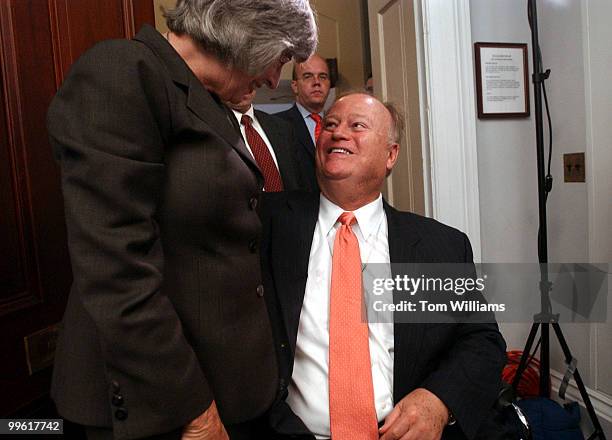 Former Senator Max Cleland is greeted by Rep. Lynn Woolsey, D-Calif., upon arriving for a bipartisan hearing on how to military disengagement from...