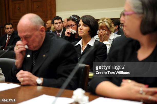 Leroy Hubley, left, and two women in the audience cry, during a House Subcommittee on Oversight and Investigations on the drug Heparin which was...