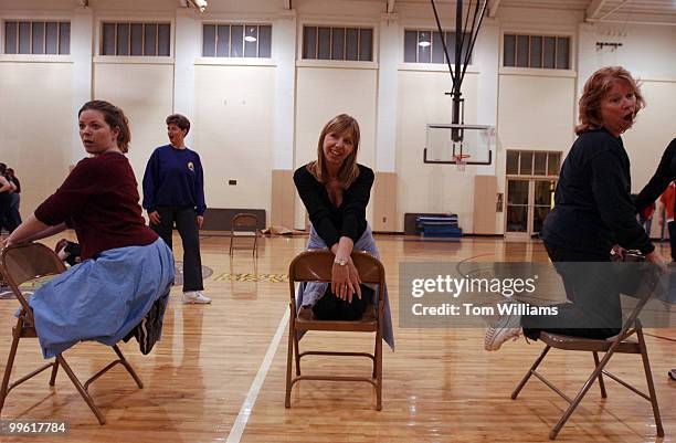 From left, Laura Schier, Jamie Sinks, and Jennifer Strand pratice a number during a rehearsal for Hexagon's 50th season of performing.
