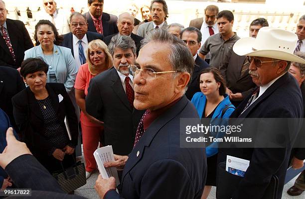 Rep. Ruben Hinojosa, D-Texas, with members of Texas government including mayors and city council members, rally after a news conference which...