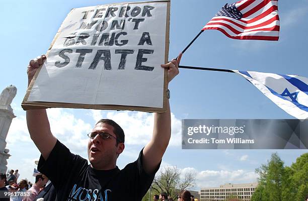 Shlomi Dinar, an Israeli American from D.C., cheers for former New York Mayor Rudolph Giuliani at the Pro Israel rally on the West Front of the...