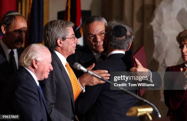 Secretary of State Colin Powell, hugs Elie Weisel, a survivor of Nazi concentration camps during the Holocaust, after Nobel Peace Prize winner...