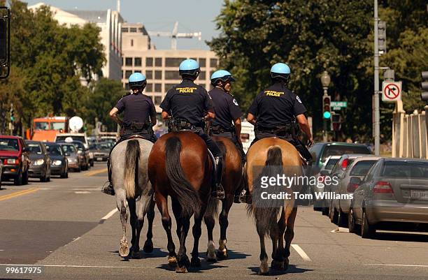 Members of the Capitol Police Mounted Unit, make their way down 3rd Street on the Mall, after finishing their last assignment. The unit was disbanded...