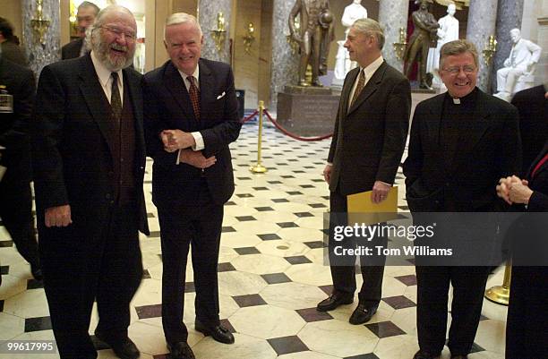 Rep. Amo Houghton, R-NY, poses with former house chaplain James Ford, far left, in Statuary Hall, during a chance meeting before the annual St....