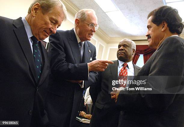 From left, Rep. Ralph Regula, R-Ohio, Supreme Court Justices Anthony Kennedy and Clarence Thomas and Rep. Jose Serrano, D-N.Y., talk before a House...