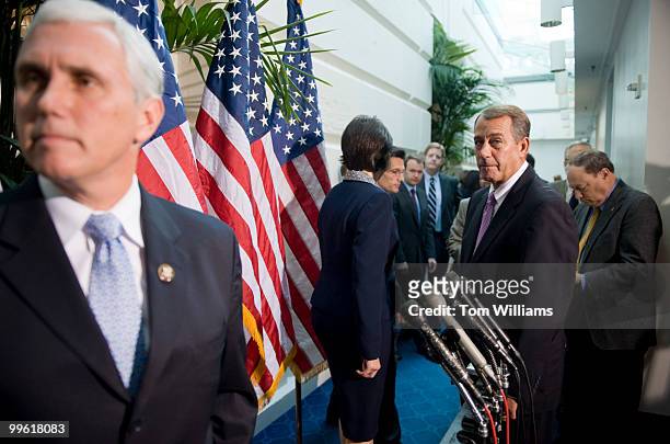 House Minority Leader John Boehner, R-Ohio, right, and Republican Conference Chair Mike Pence, listen to reporter's question after a meeting of the...