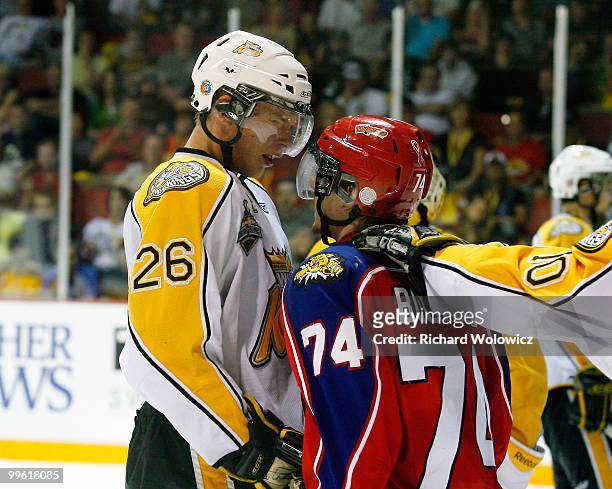 Alexander Urbom of the Brandon Wheat Kings and Gabriel Bourque of the Moncton Wildcats exchange words during the 2010 Mastercard Memorial Cup...