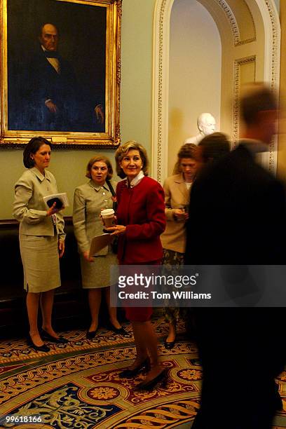 Sen. Kay Bailey Hutchison, R-Texas, prepares to go back to the Senate Chamber after confering with staff members during the "vote-a-rama."