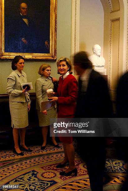 Sen. Kay Bailey Hutchison, R-Texas, prepares to go back to the Senate Chamber after confering with staff members during the "vote-a-rama."