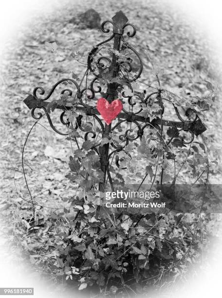 iron cross with red heart, black and white, grave in a cemetery, france - iron cross stock pictures, royalty-free photos & images