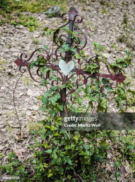 iron cross with heart grave in a cemetery, france - iron cross stock pictures, royalty-free photos & images