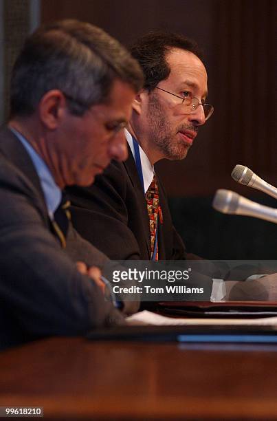 At right, Dr. Walter Ornstein, Director, National Immunization Program Centers for Disease Control and Prevention, testifies alongside Dr. Anthony...