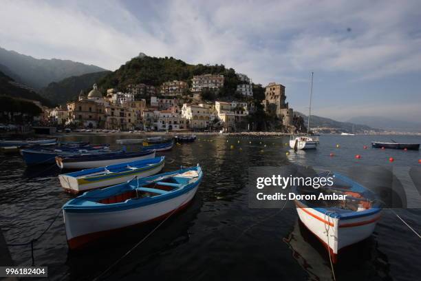 boats moored near mediterranean old town on seashore - doron stock pictures, royalty-free photos & images