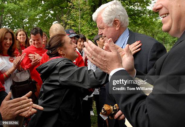 Nicole Pedone of Cleveland, gives a hug to Sen. Ted Kennedy, D-Mass., before a news conference to oppose S.1995, the "Health Insurance Marketplace...