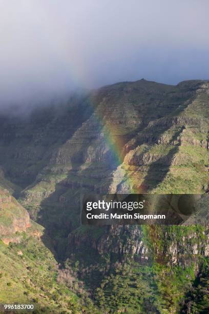 rainbow, view from mirador cesar manrique, valle gran rey, la gomera, canary islands, spain - mirador stock pictures, royalty-free photos & images