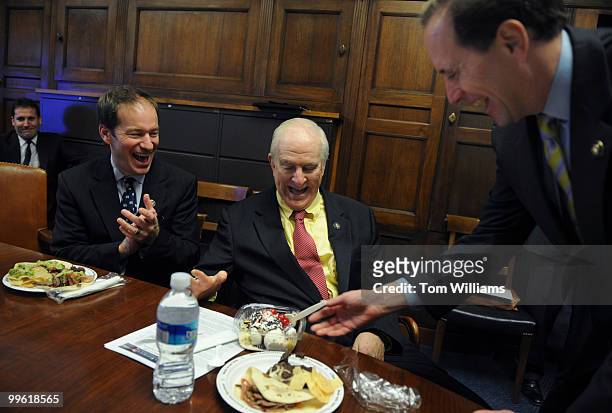 Rep. Sam Johnson, R-Texas, receives a banana split from Rep. Dave Camp, R-Mich., during the House Ways and Means weekly lunch, February 11 in honor...