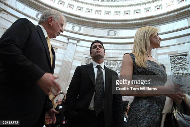 Driver Jimmie Johnson, center, and his wife Chandra, are escorted through the rotunda, to meeting with Speaker Nancy Pelosi, D-Calf., by Rep. Mike...