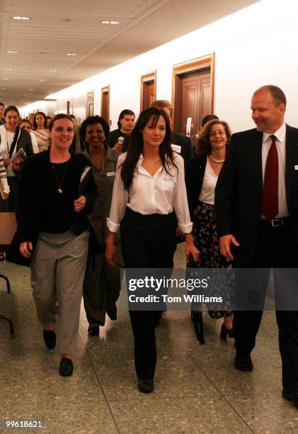 Angelina Jolie, actress and Goodwill Ambassador for United Nations High Commissioner for Refugees, leaves a news conference with Sens. Diane...