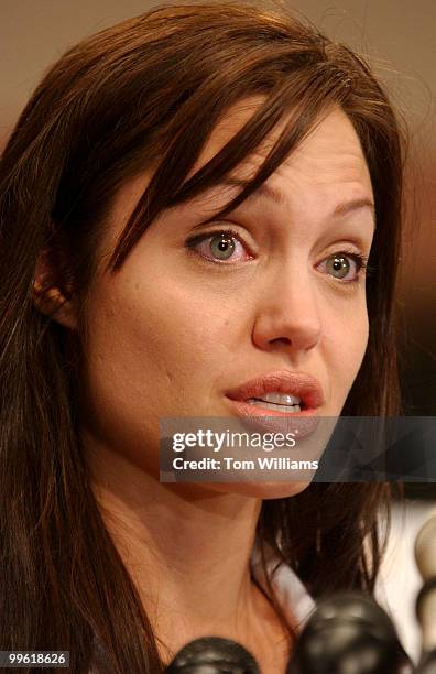 Angelina Jolie, actress and Goodwill Ambassador for United Nations High Commissioner for Refugees, attend a news conference with Sens. Diane...