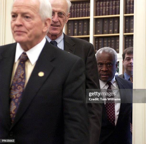 Supreme Court Justice Clarence Thomas, right, makes his way into a hearing of the House Appropriations Subcommittee, alonside Rep. Joe Knollenberg,...