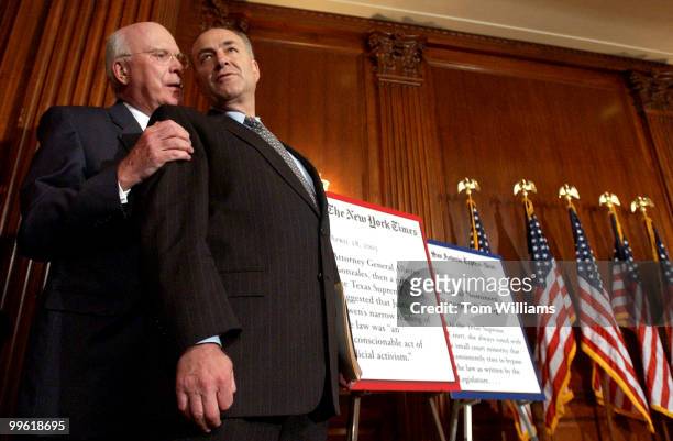 Sen. Pat Leahy, D-Vt., has a word with Sen. Chuck Schumer, D-N.Y., during a news conference with Texas civic leaders to urge the Senate to oppose...