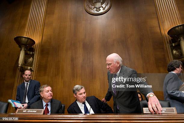 Chairman of the Senate Judiciary Committee Pat Leahy, D-Vt., right, talks with Sen. Sheldon Whitehouse, D-R.I., center, and Sen. Lindsey Graham,...