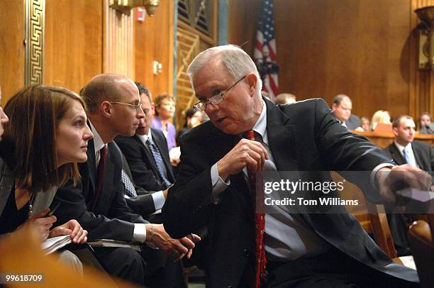 Sen. Jeff Sessions, R-Ala., speaks with his staff during a Senate Judiciary Committee markup, Thursday.