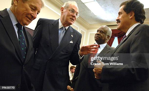 From left, Rep. Ralph Regula, R-Ohio, Supreme Court Justices Anthony Kennedy and Clarence Thomas and Rep. Jose Serrano, D-N.Y., talk before a House...