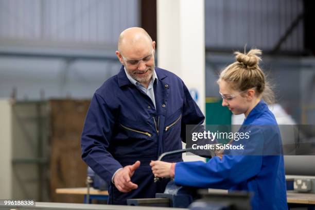 sawing in the engineering workshop - apprenticeship stock pictures, royalty-free photos & images