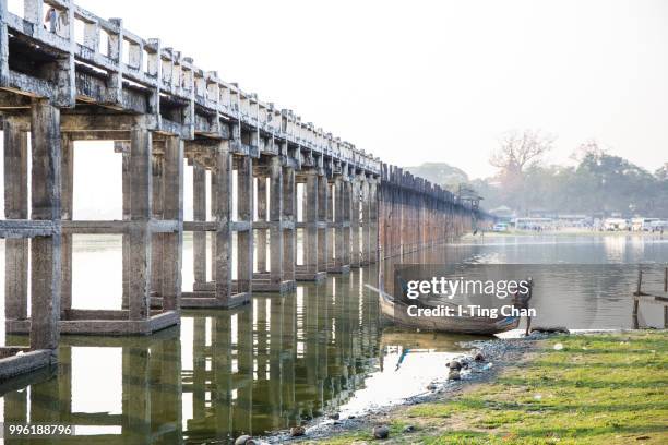 fisherman and his boat, u bein bridge - bein stockfoto's en -beelden