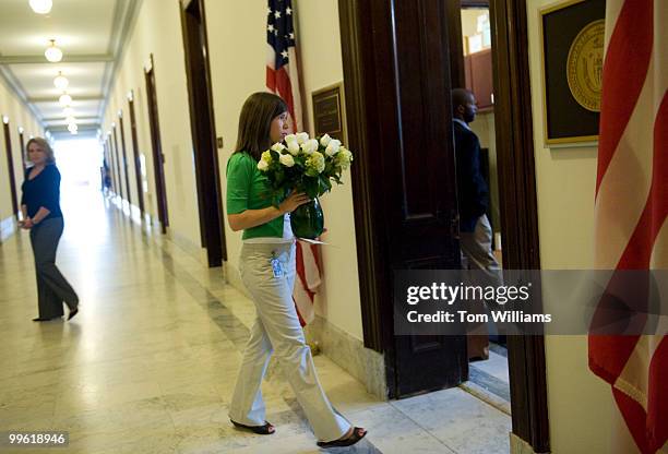 Cassandra Koehler from the office of Sen. Herb Kohl, D-Wisc., delivers flowers to the Russell office of Sen. Ted Kennedy, D-Mass., who passed away...