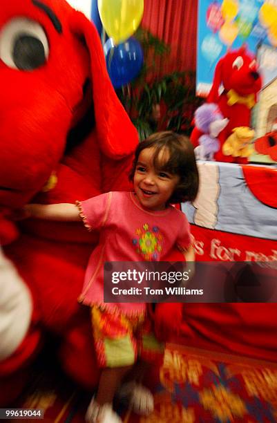 Lillian Keller, 23 months, duaghter of Kennan Keller of the House Judiciary Committee, meets Clifford the Big Red Dog, during PBS's Kids Day event...