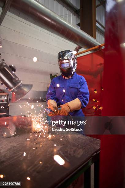 welding in the engineering workshop - automatic welding torch stock pictures, royalty-free photos & images