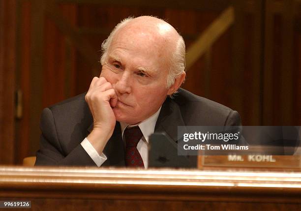 Sen. Herbert Kohl, D-Wis., listens to Colin Powell at a hearing on the FY04 budget for the State Department and potential military action in Iraq.