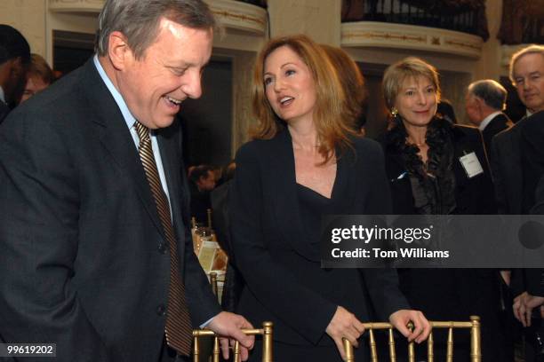 Journalist Andrea Koppel talks with Sen. Dick Durbin, D-Ill., before a dinner held by the U.S. Global Leadership Campaign to pay tribute to Durbin...