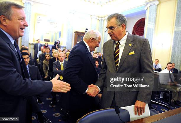 Ray LaHood, Secretary of Transportation nominee, right, greets former House Minority Leader Bob Michel and Senate Minority Whip Richard Durbin,...