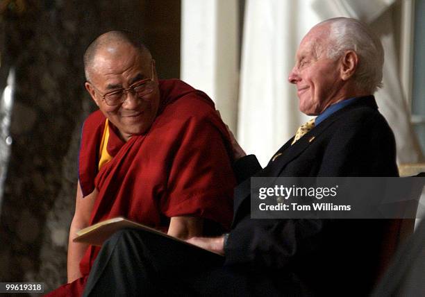 The Dalai Lama speaks to Rep. Tom Lantos, D-Calif., at a ceremony celebrating the 20th Anniversary of the Human Rights Caucus.