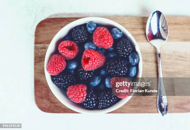 a bowl full of berries - kunde stock pictures, royalty-free photos & images