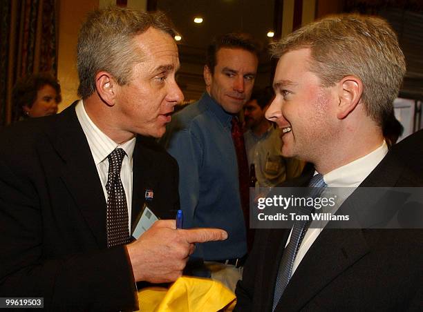 Three time Tour de France winner Greg LeMond, left, speaks to John W. Miller, staffer for Rep. Jerry Kleczka, D-Wis., at a recepiton in Rayburn,...