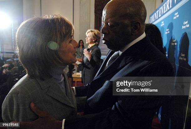 Rep. John Lewis, D-Ga., talks with Sen. Barbara Boxer, D-Calif., during a news conference on the 42nd anniversary of Bloody Sunday in Selma, Ala.,...